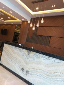 a large reception desk in a lobby with wood paneling at EMA ÖZTÜRK THERMAL HOTEL in Afyon