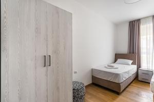 Postel nebo postele na pokoji v ubytování Apartments LM RESIDENCE