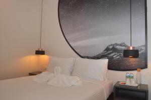 Postel nebo postele na pokoji v ubytování De Luna Hotel Sri Petaling