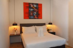 Postel nebo postele na pokoji v ubytování De Luna Hotel Sri Petaling