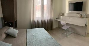 Voodi või voodid majutusasutuse B&b estercarlo toas