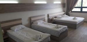 Voodi või voodid majutusasutuse Cross Health Spa Center toas