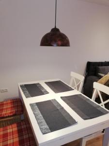 a dining room table with a black and white pattern on it at Ausseeerland in Bad Aussee