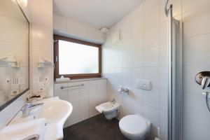Koupelna v ubytování Hotel Kesslwirt
