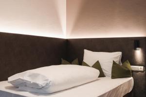 Postel nebo postele na pokoji v ubytování Hotel Kesslwirt