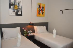 Postel nebo postele na pokoji v ubytování De Luna Hotel Sri Petaling + 37 fotografií