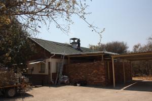 a roof being installed on a house at Woodlands Stop Over and Lodge in Francistown