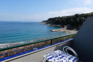 a balcony with a view of the ocean at Hotel Baia Di Puolo in Massa Lubrense