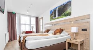 Voodi või voodid majutusasutuse Hotel Duus by Keflavik Airport toas