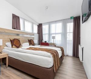 Voodi või voodid majutusasutuse Hotel Duus by Keflavik Airport toas