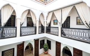 an image of the inside of a building with balconies at RIAD LA GAZELLE DU SUD in Marrakesh
