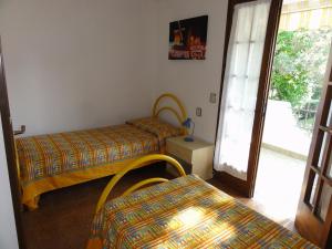 Ένα ή περισσότερα κρεβάτια σε δωμάτιο στο Villa Amalfi