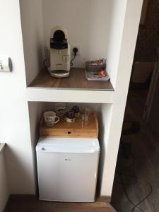 Kuchyň nebo kuchyňský kout v ubytování MANOIR AUX trois charmes