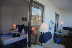 Postel nebo postele na pokoji v ubytování Hotel-Restaurant "Veldener Traumschiff" direkt am See in 2min im Zentrum