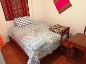 Postel nebo postele na pokoji v ubytování Carlos Guest House 3 Cusco