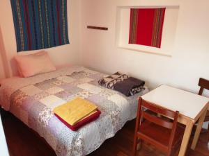 Postel nebo postele na pokoji v ubytování Carlos Guest House 3 Cusco