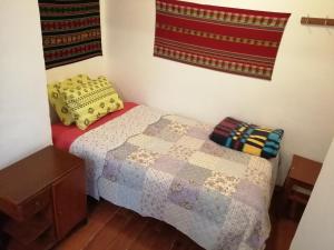 Postel nebo postele na pokoji v ubytování Carlos Guest House 3 Cusco