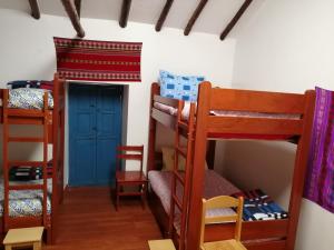 Postel nebo postele na pokoji v ubytování Carlos Guest House 3 Cusco