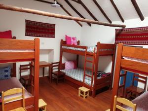 Postel nebo postele na pokoji v ubytování Carlos Guest House 3 Cusco