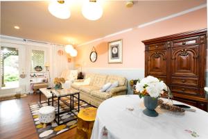 a living room with a couch and a table at Lily's garden in Charlottetown