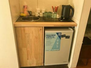 a kitchen with a sink and a counter top at Hotel Messina in Mar del Plata