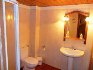 a bathroom with a toilet and a sink at Cases Tonet in Forcall +76 photos