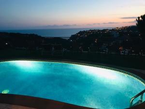 a swimming pool with a view of the ocean at Luxury Villa Marina in Lloret de Mar +39 photos