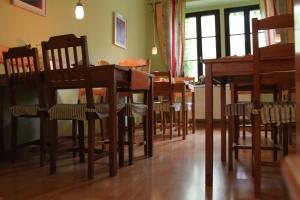 a dining room with wooden chairs and tables at Hostel Louise 20 in Dresden