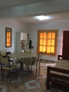 a dining room with a table and chairs and a window at Departamento Libertad in San Salvador de Jujuy +7 photos