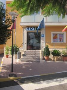 a hotel building with a sign on the front of it at Hotel Totana Sur in Totana