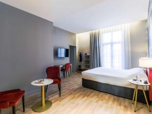Un ou plusieurs lits dans un hébergement de l'établissement Ibis Styles Toulouse Capitole