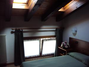 Säng eller sängar i ett rum på Agriturismo Sant' Anna