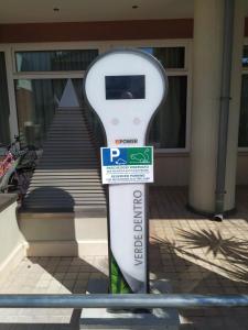 a parking meter sitting in front of a building at Best Western Hotel Dei Cavalieri in Barletta