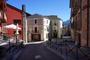 an empty street in a town with buildings at Fonda Biayna in Bellver de Cerdanya