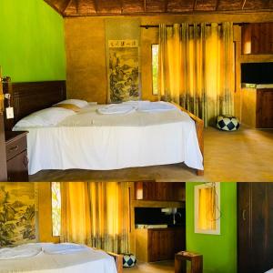 a bedroom with a bed in a room with green at Crown Holiday Village near Marawila in Nattandiya