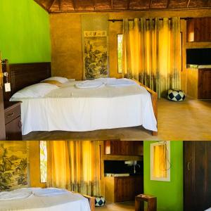 מיטה או מיטות בחדר ב-Crown Holiday Village near Marawila