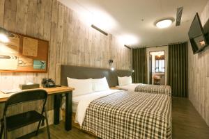 Postel nebo postele na pokoji v ubytování Hotel PaPa Whale