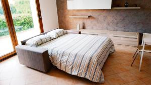 En eller flere senge i et værelse på Appartamento Ciesazza