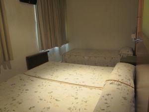 Postel nebo postele na pokoji v ubytování Hotel Totana Sur