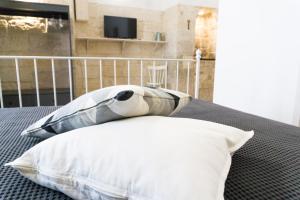 Postel nebo postele na pokoji v ubytování Donato Rooms