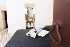 Postel nebo postele na pokoji v ubytování Donato Rooms