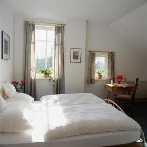 מיטה או מיטות בחדר ב-Landgasthof Pleister Mühle