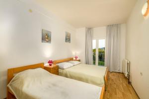 Postel nebo postele na pokoji v ubytování Studio Holiday Adriatic