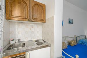 Kuchyň nebo kuchyňský kout v ubytování Studio Holiday Adriatic