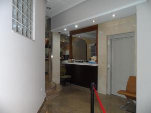 a hallway with a bar in a building at Hostal Coruña in Astorga