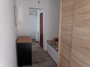 a hallway with a room with a desk and a door at Sky line center city F 4th floor in Aigio