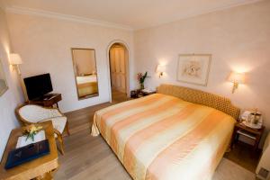 Voodi või voodid majutusasutuse Romantik Hotel Castello Seeschloss toas