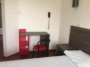 Postel nebo postele na pokoji v ubytování Hotel 42 Avenida