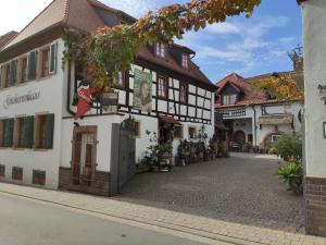 a street in a town with a building at Gutsherrenhaus in Maikammer