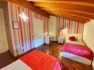 a bedroom with a bed and a cross on the wall at La Borasca - B&B in Casalpusterlengo